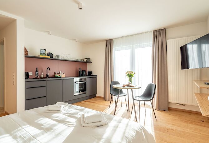 Stuub Saig Studio Wohnbereich Bett Kueche